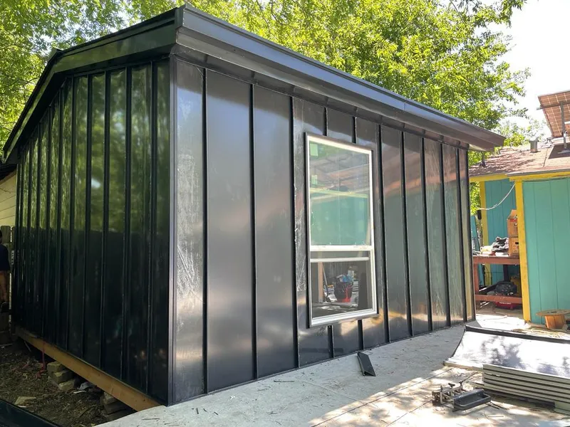 Black standing seam metal wall panels for Roof Inspection in Norfolk